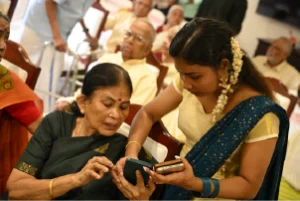 Resident at Season Two Kakkanad Senior Living, interacting with healthcare staff